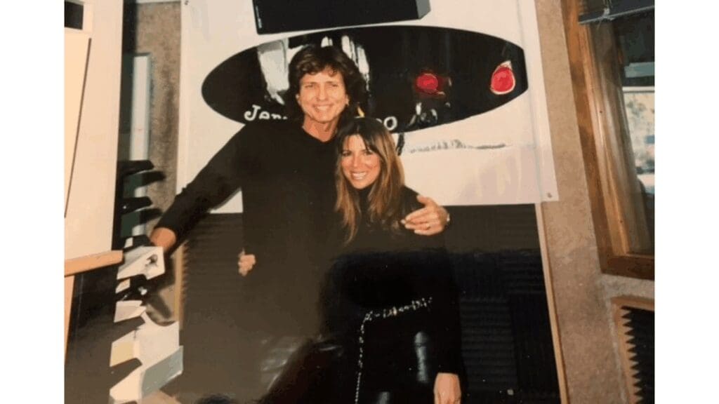 Two people posing happily together indoors.