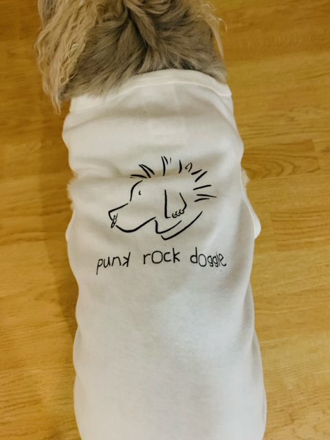 Dog wearing a white shirt with a hand-drawn guitar and 'punk rock dog' text.