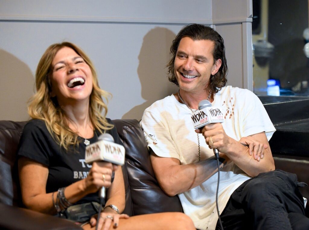 Two people laughing during an interview.