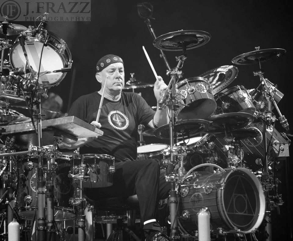 Drummer playing on an elaborate drum set.
