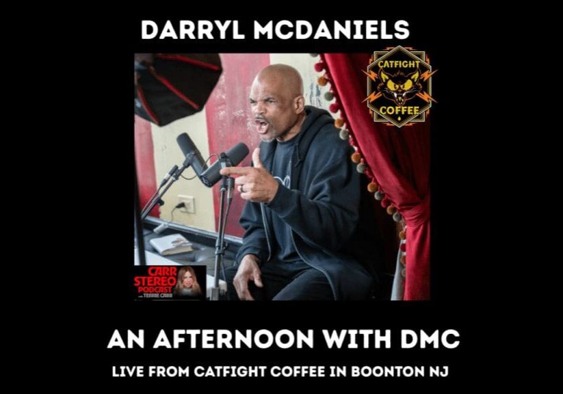 Man speaking into microphone at Catfight Coffee.