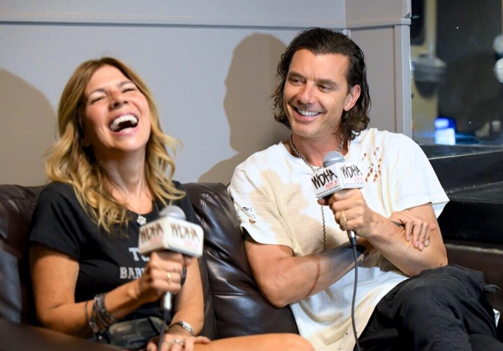 Two people laughing during an interview.