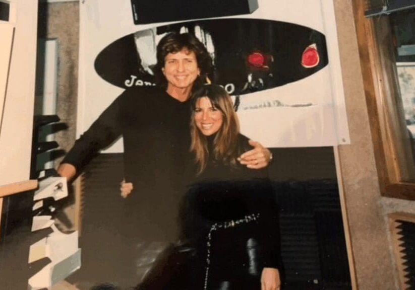 Two people posing happily together indoors.